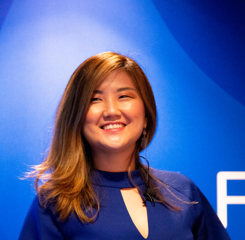 the profile photo of Qin in public speaking spot light